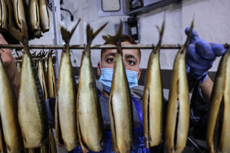 Smoked mackerels are on display at a fish market before the Eid Al Fitr holiday, in the town of Rafah, in southern Gaza Strip. AFP