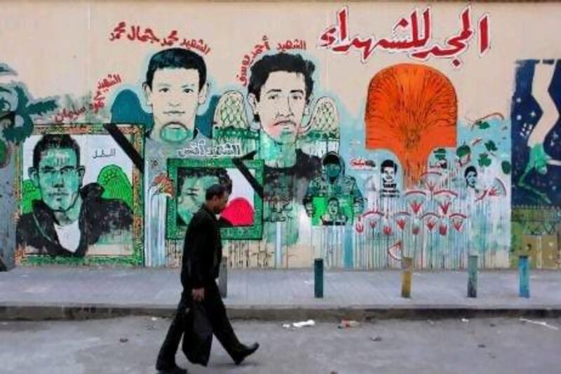 A mural in Tahrir Square commemorates fans of Cairo's Al Ahly club who died in Port Said.