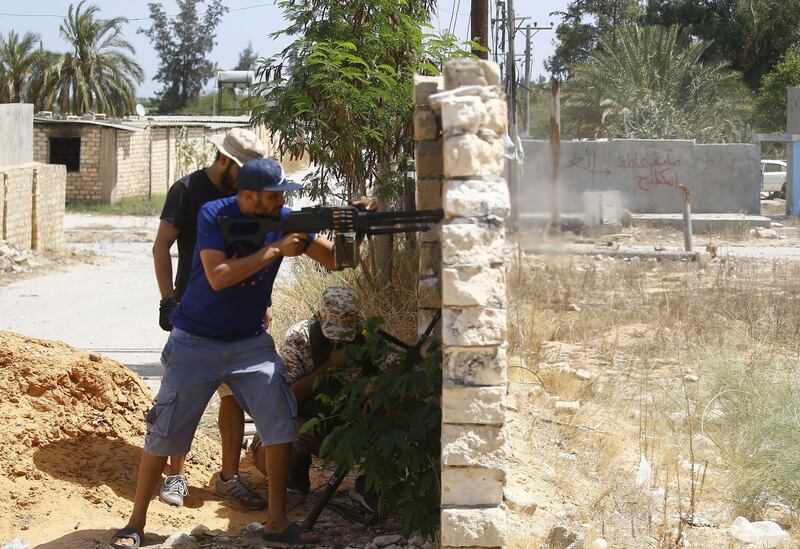 A fighter loyal to the internationally recognised Libyan Government of National Accord (GNA) fires his gun during clashes with forces loyal to strongman Khalifa Haftar in the capital Tripoli's suburb of Ain Zara.  AFP