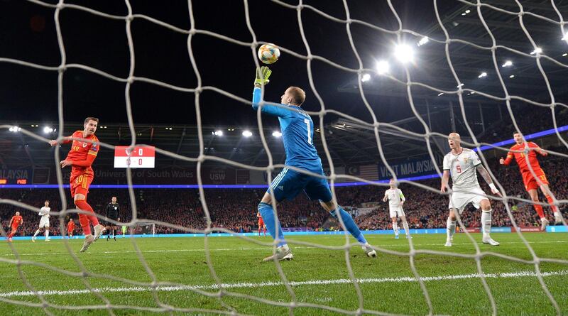 Wales midfielder Aaron Ramsey scores their first goal. EPA