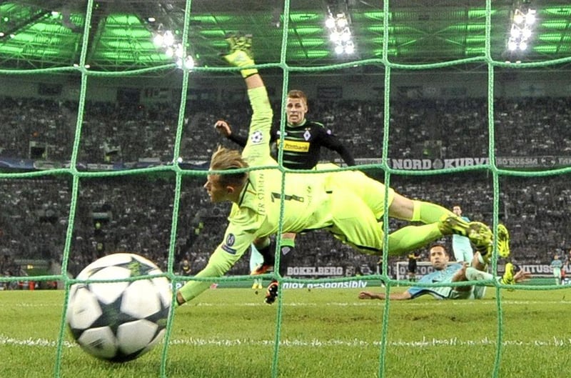 Borussia Monchengladbach’s Thorgan Hazard scores the opening goal past Barcelona goalkeeper Marc-Andre ter Stegen. Martin Meissner / AP Photo