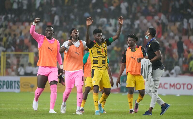 Ghana players celebrate after the match. AP