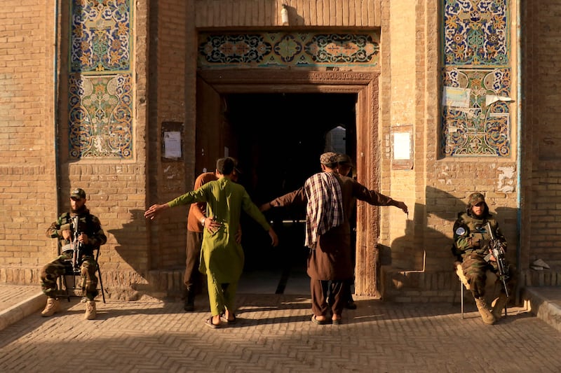 Security personnel frisk devotees entering Jami mosque in Herat, western Afghanistan, to offer Eid Al Adha prayers. AFP
