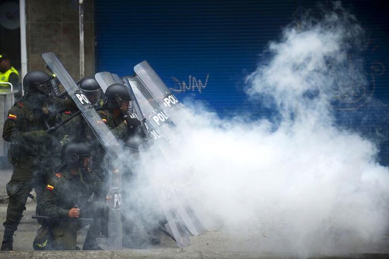 Riot policemen clash with protestors during a May Day workers parade on May 1, 2014 in Medellin, Colombia. Raul Arboleda / AFP