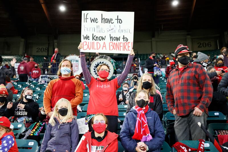 Portland Thorns fan holds a sign before a NWSL soccer match against Houston Dash. Reuters