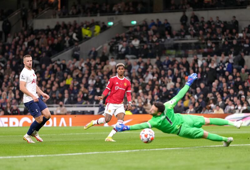 Marcus Rashford scores the third. PA