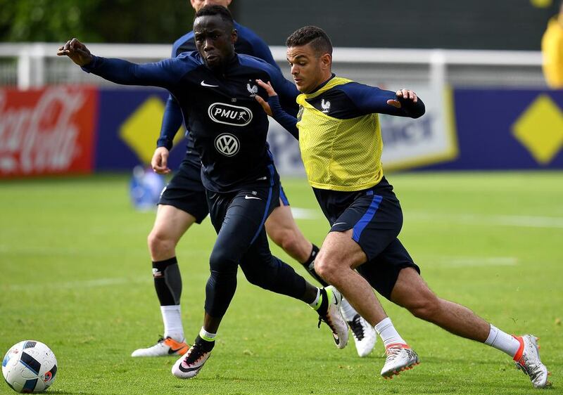 France forward Hatem Ben Arfa, right, vies with defender Bacary Sagna during a training session in Biarritz. Franck Fife / AFP