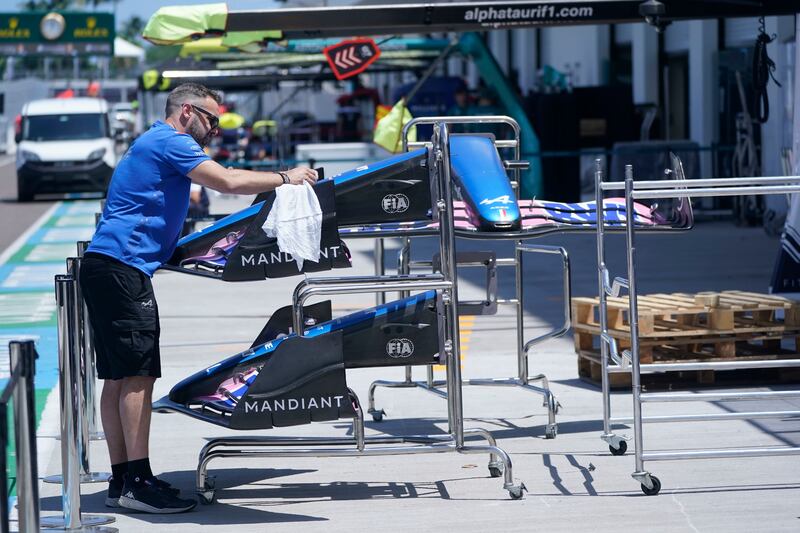 An Alpine crew member works on a nose and wing assembly as teams prepare for Sunday's Formula One Miami Grand Prix.