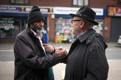 George Galloway greets members of the public while canvassing in the Rochdale. Getty Images