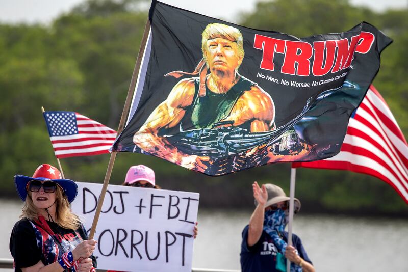 Supporters of former president Donald Trump remain have maintained a vigil outside his Mar-a-Lago residence since the raid. EPA