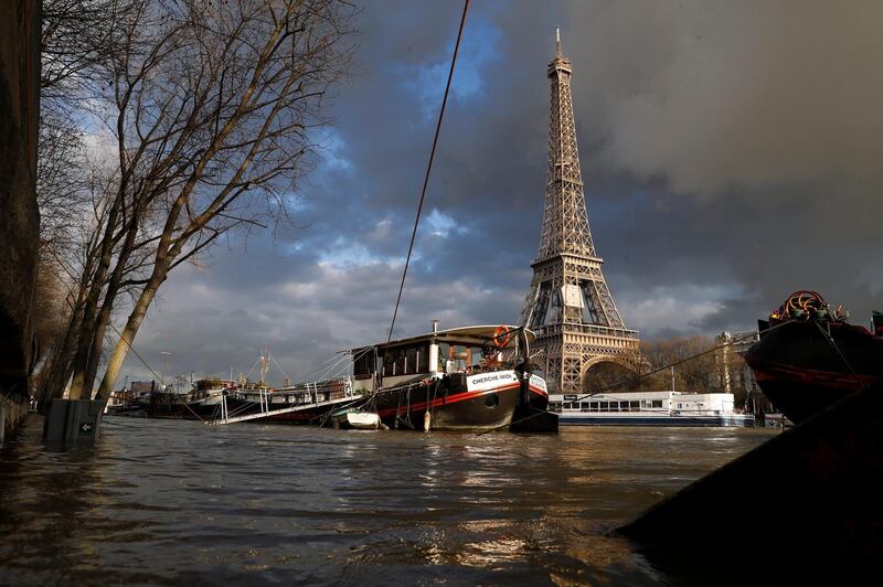 Floodwaters overflow the banks of the Seine river near the Eiffel Tower in Paris. Etienne Laurent / EPA