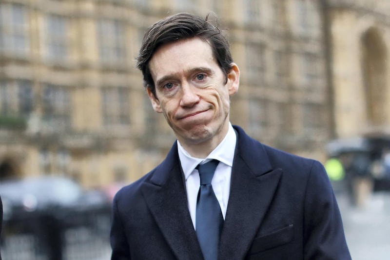 Conservative MP Rory Stewart reacts as he walks past the Houses of Parliament in central London on January 16, 2019. - Prime Minister Theresa May was left "crushed" and "humiliated", Britain's newspapers said today as they raked over the fallout from parliament's huge rejection of her EU divorce deal. (Photo by Tolga AKMEN / AFP)