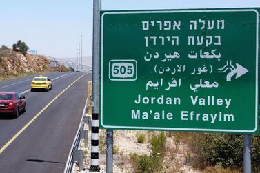 Cars with Palestinian licence plates drive through the Tapuach junction, near Nablus, towards the Jordan Valley in the occupied West Bank, on July 1, 2020. AFP