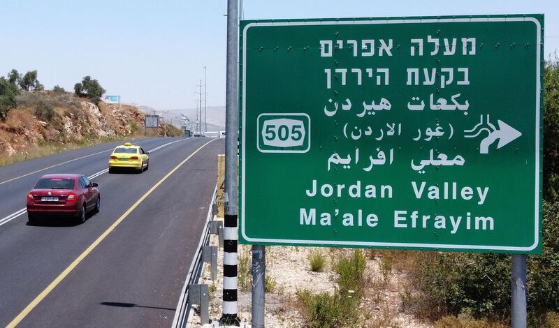 Cars with Palestinian license plates drive through the Tapuach junction, near Nablus, towards the Jordan Valley in the occupied West Bank, on July 1, 2020.  The government of Israeli Prime Minister Benjamin Netanyahu has said it could begin the process to annex Jewish settlements in the West Bank as well as the strategic Jordan Valley from today. The plan -- endorsed by Washington -- would see the creation of a Palestinian state, but on reduced territory, and without Palestinians' core demand of a capital in east Jerusalem. / AFP / JACK GUEZ
