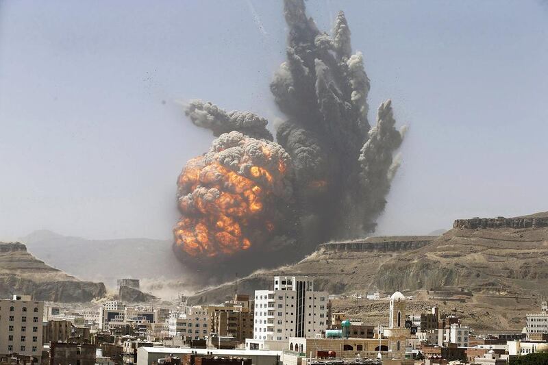 Smoke rises during an air strike on an army weapons depot on a mountain overlooking Sanaa on April 20. Khaled Abdullah/Reuters