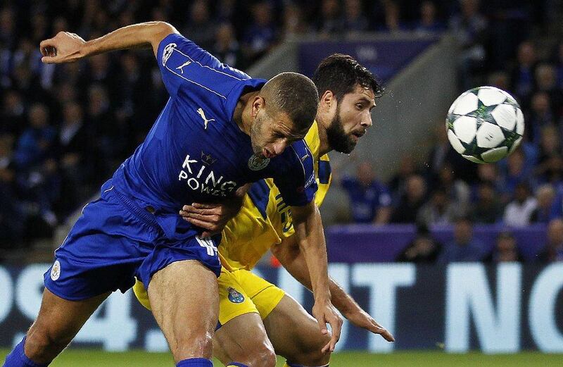 Leicester City’s Algerian striker Islam Slimani, left, scores his team’s first goal in the Champions League Group G match. Ian Kington / AFP