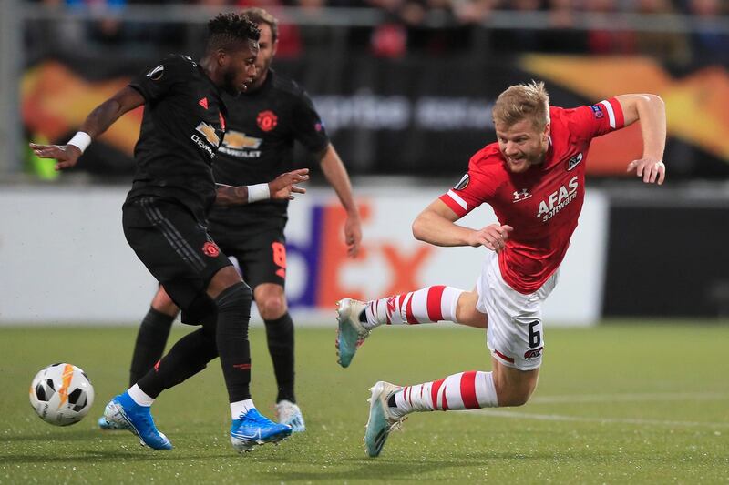 Manchester United's Fred, left, and Alkmaar's Fredrik Midtsjo. Associated Press
