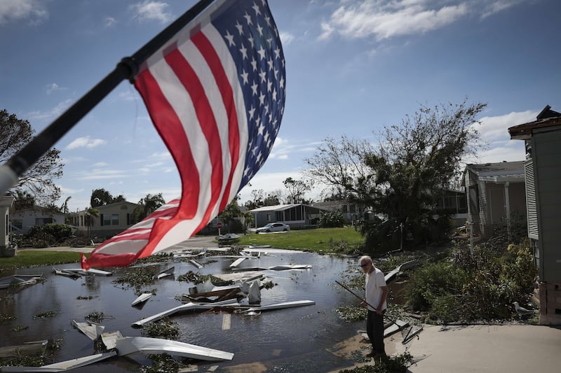 Tom Park begins cleaning up after Hurricane Ian moved through the Gulf Coast in Punta Gorda, Florida. AFP