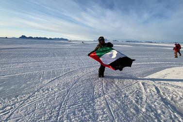 Khawla AlRomaithi flying the UAE flag in Antartica at the start of her record-breaking journey across the world's continents. Courtesy Khawla AlRomaithi