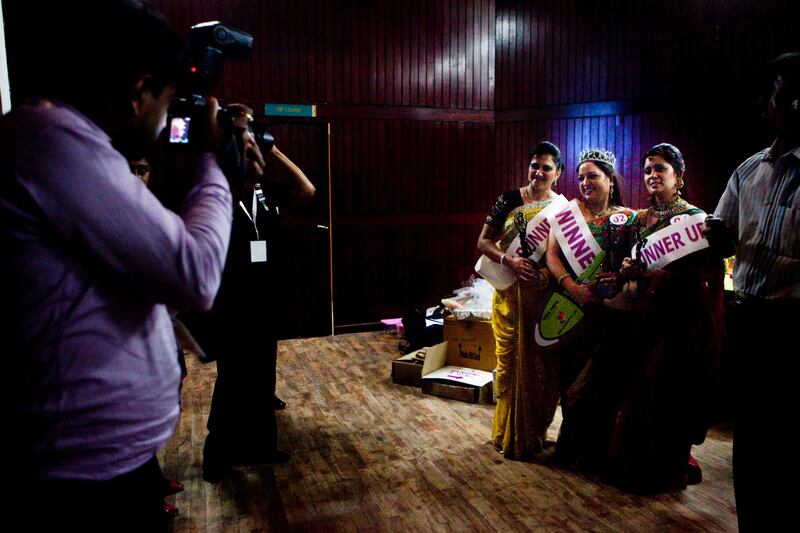 Winner Jyoti Nagpal, 35, is greeted by friends as she is photographed backstage after the winner's announcement at the inaugural AAS Housewives Awards 2012 on 19th May 2012 in New Delhi, India. Photo by Suzanne Lee for The National