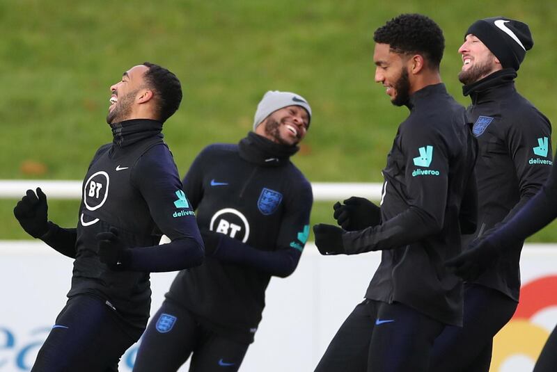 Raheem Sterling is all smiles during an England training session. Reuters
