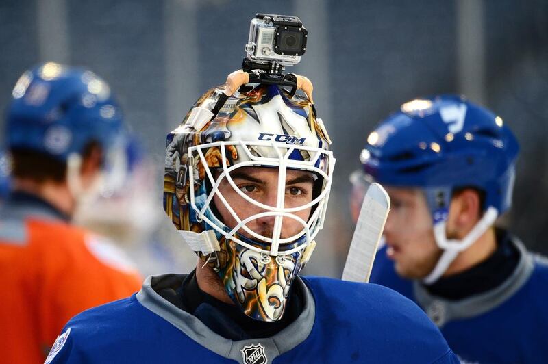 Kevin Poulin of the New York Islanders skates with a GoPro camera on his helmet during the 2014 NHL Stadium Series practice session in January 2014. Professional athletes and weekend warriors alike attach GoPro cameras to their surfboards, snowboards, bike handles and helmets to record their actions. Brian Babineau / NHLI via Getty Images