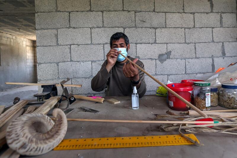 Palestinian man Mohammad Abu Musaed makes bows and arrows for his horseback archery team in the central Gaza Strip. The 40-year-old wants to build a team that can compete internationally. Reuters