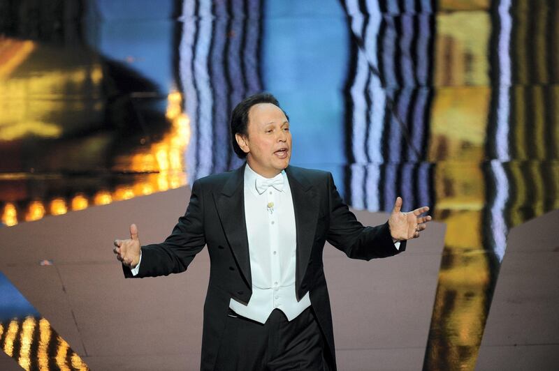Actor Billy Crystal hosts the ceremony of the 84th Annual Academy Awards on February 26, 2012 in Hollywood, California. AFP PHOTO Robyn BECK (Photo by ROBYN BECK / AFP)