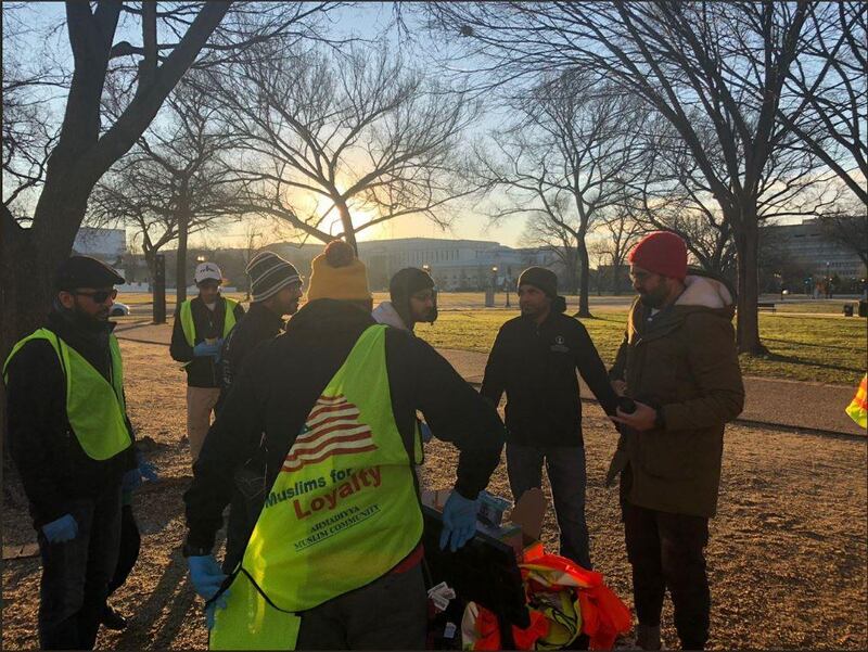 Members of the Ahmadiyya Muslim Youth Association clean up the National Mall in Washington DC