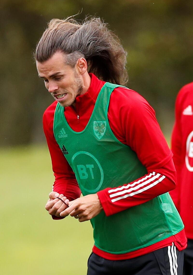 Gareth Bale fixes his hair. Reuters