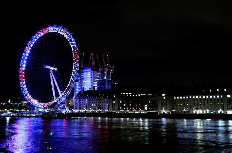 The London Eye is illuminated red, white and blue to show support for the The Duke and Duchess of Cambridge as they welcome their new baby son on April 23, 2018 in London, England.  (John Phillips/Getty Images)