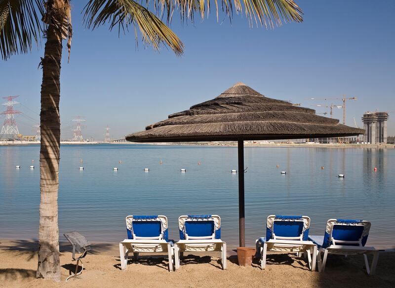 Abu Dhabi - December 22, 2008: A man walks on the beach at Le Meridien. ( Philip Cheung / The National ) *** Local Caption ***  PC0007-TouristClub.jpgHH03JA NEIGH TOURIST 01.jpg