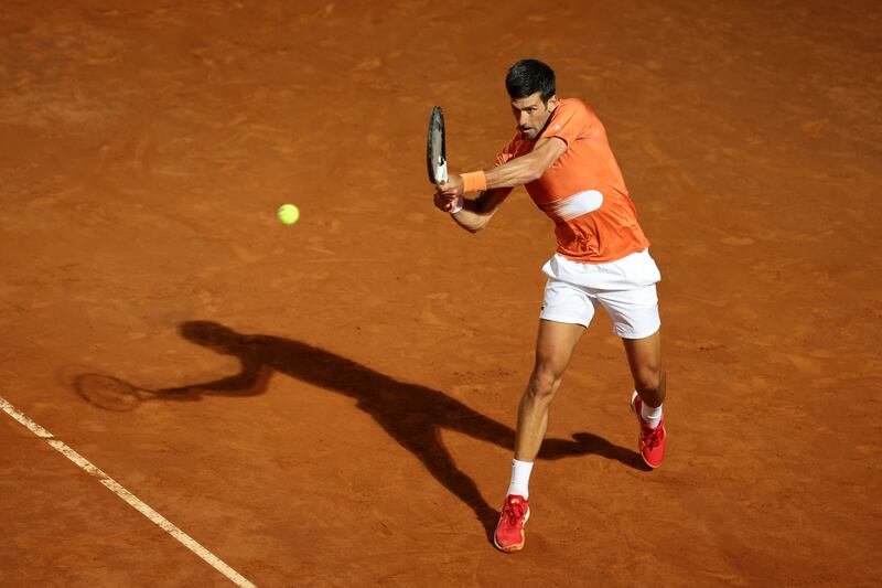 Novak Djokovic plays a backhand to Casper Ruud during the Italian Open semi-finals. Getty