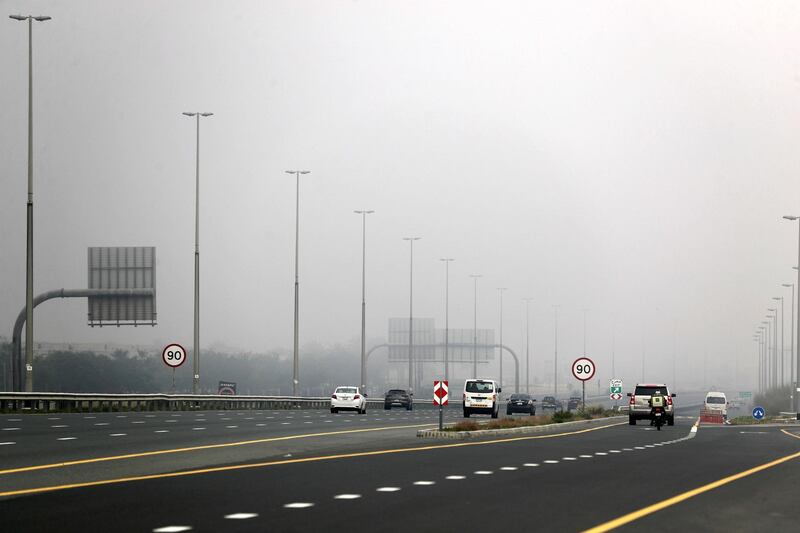 Dubai, United Arab Emirates - Reporter: N/A: Weather. Cars go down a fogy road near Sustainable City. Thursday, April 2nd, 2020. Dubai. Chris Whiteoak / The National