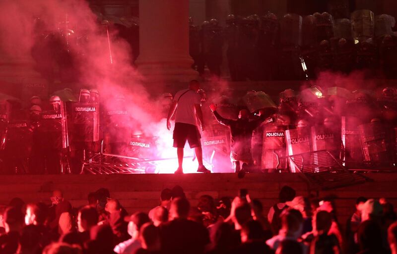 Demonstrators clashed with riot police and set off flares. Reuters