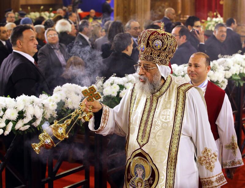 epa06421521 Egyptian Coptic Pope Tawadros II (C), Pope of Alexandria and Patriarch of Saint Marc Episcopate Pope, head of the Egyptian Coptic Orthodox Church, leads a Christmas eve mass held at the new Coptic Cathedral at the new administrative capital, 45km east of Cairo, Egypt, 06 January 2018, during the celebrations of the Eastern Christmas in Egypt.  EPA/KHALED ELFIQI