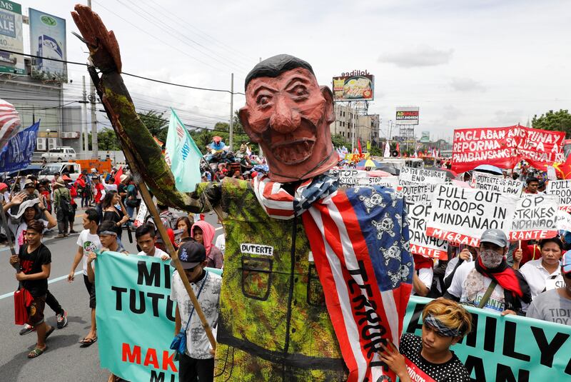 Anti-government protesters display an effigy of president Rodrigo Duterte during a march towards the Philippine Congress ahead of Duterte's State of the Nation address in Quezon city, Metro Manila Philippines. Erik De Castro / Reuters