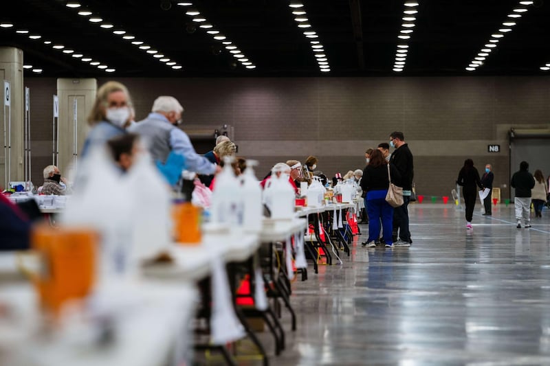 LOUISVILLE, KY - NOVEMBER 03: Election officials wait near a long line of hand sanitizer bottles at the Kentucky Exposition Center on November 3, 2020 in Louisville, Kentucky. After a record-breaking early voting turnout, Americans head to the polls on the last day to cast their vote for incumbent U.S. President Donald Trump or Democratic nominee Joe Biden in the 2020 presidential election.   Jon Cherry/Getty Images/AFP
== FOR NEWSPAPERS, INTERNET, TELCOS & TELEVISION USE ONLY ==
