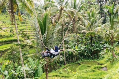 Teenager swinging Over in Tegallalang Ubud. Getty Images