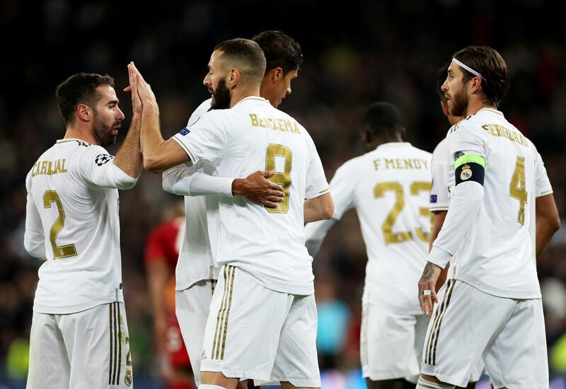 Karim Benzema celebrates with Daniel Carvajal after scoring Real's fourth against Galatasaray. Getty