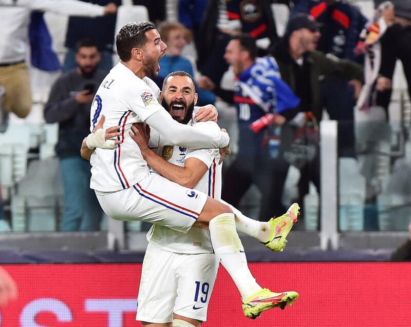 Theo Hernandez celebrates with  Karim Benzema after scoring France's winning goal against Belgium in the Nations League semi-finals. Reuters