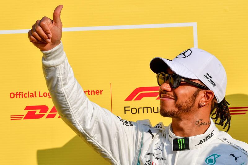 Hamilton gives the thumbs up ahead of the final race. AFP