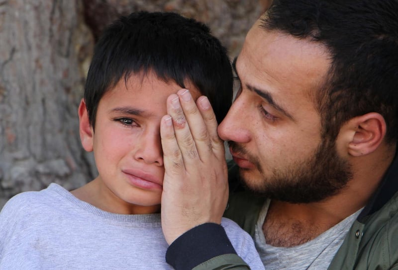 KABUL, AFGHANISTAN-JUNE 07: Mustafa Tamanna, 10, son of Afghan reporter Zabihullah Tamanna, weeps during the funeral ceremony in Kabul, Afghanistan on June 7, 2016. Anadolu Agency freelance reporter Zabihullah Tamanna and David Gilkey were killed in a Taliban attack in southern Afghanistan on Sunday, according to an Afghan military spokesman.  (Photo by Haroon Sabawoon/Anadolu Agency/Getty Images)