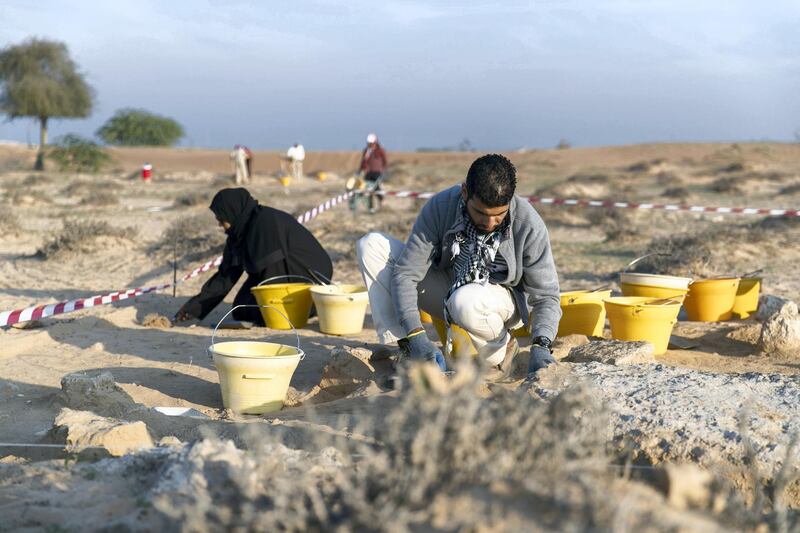 UMM AL QUWAIN, UNITED ARAB EMIRATES - DECEMBER 26, 2018. 

Meqdad Abu Al Jared, archaeologist, and Mariam Mohammed, a workshop participant at Ed-Dur, one of the largest archaeological sites in the UAE.

The antiquities and heritage department in UAQ is offering people a  10-day archaeology exploration course at the site.

(Photo by Reem Mohammed/The National)

Reporter: RUBA HAZA
Section:  NA