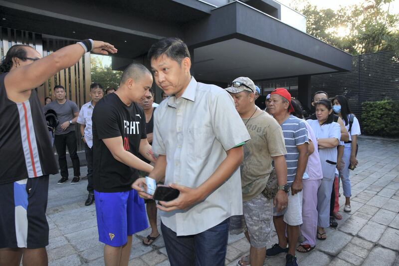 Fans and well-wishers line up in Manny Pacquiao's residence to receive "blessings" for Christmas. Each person receives one thousand pesos as a gift.