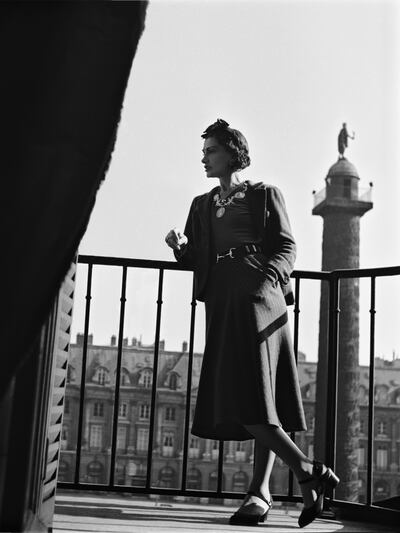 A handout photo of Gabrielle Chanel at the balcony of her suite at The Ritz hotel in Paris in 1937. (Roger Schall / Collection Schall) *** Local Caption ***  lm10de-chanel-necklace07.jpg