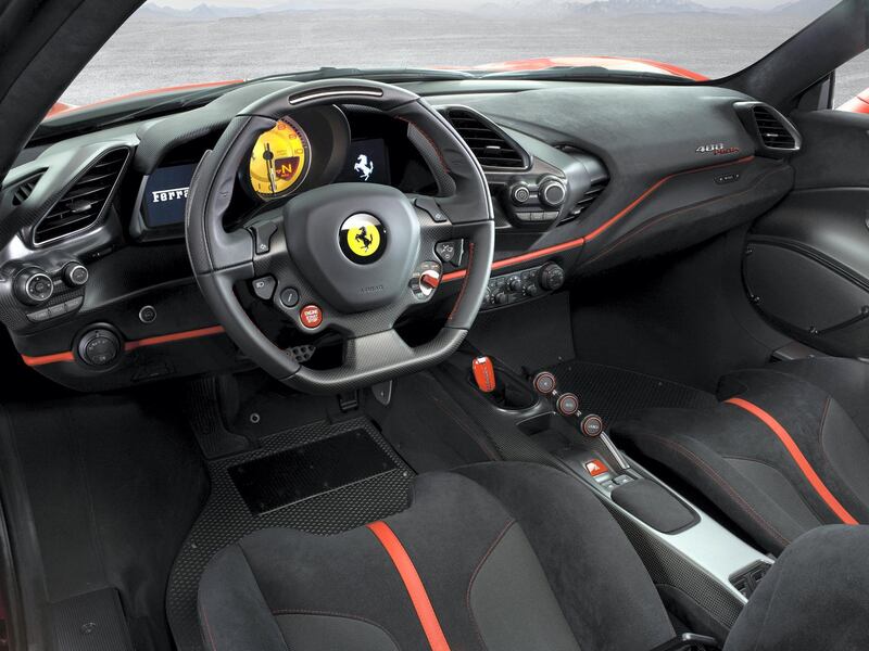 Carbon is all over the interior, alongside lashings of Alcantara. Ferrari