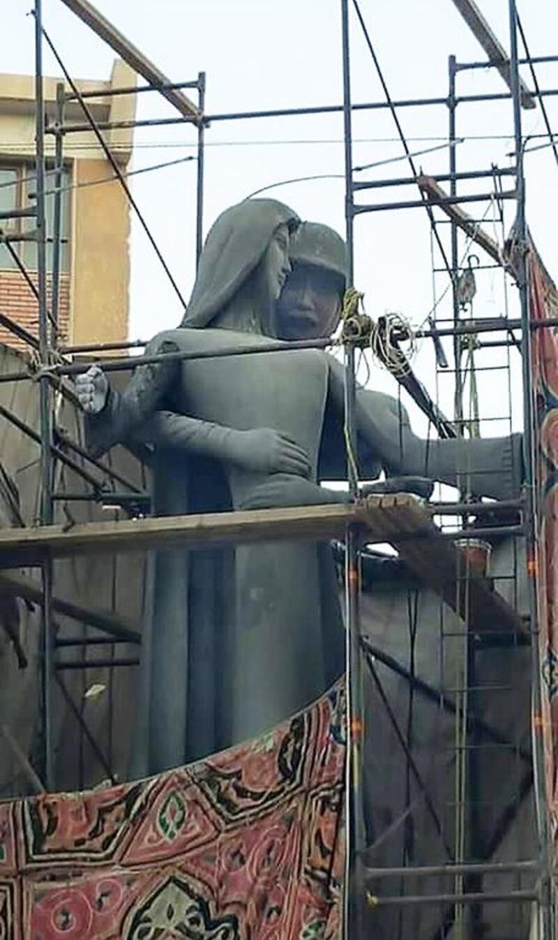 A sculpture, titled 'Mother of the Martyr', depicts a slender peasant woman, a traditional artistic representation of Egypt, with her arms outstretched while a helmeted soldier stands behind her with his arms wrapped around her waist, at a public square in Sohag, Egypt. Social media is abuzz, saying it appears to depict an unwanted advance on a woman. Mahmoud Ahmed/AP Photo