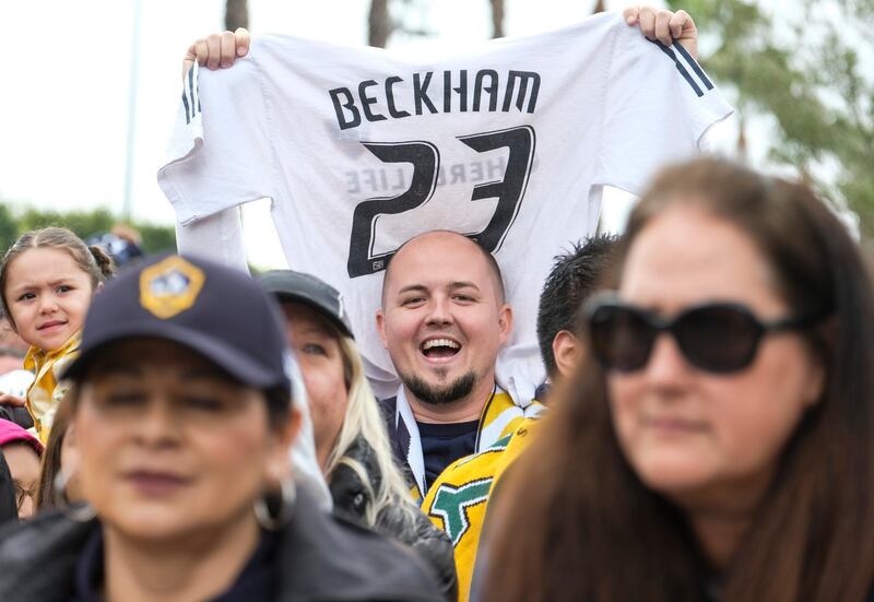 A fan holds a jersey during the unveiling ceremony. AP Photo
