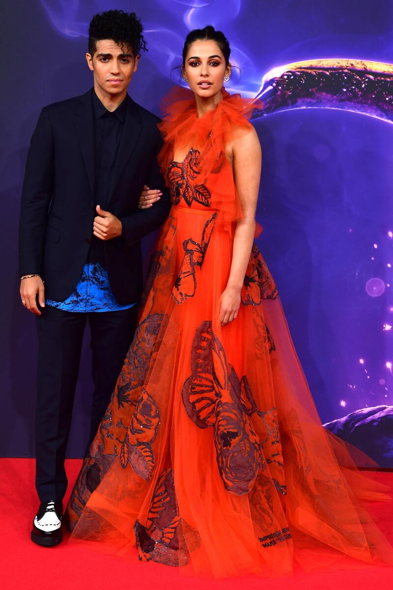 Mena Massoud, who plays Aladdin, and Naomi Scott, who plays Jasmine, walk the red carpet at the Berlin screening. EPA.